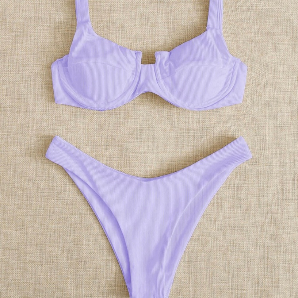 Two piece purple bathing suit.